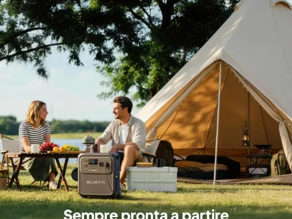 Coppia che si rilassa vicino a una tenda con generatore Bluetti Elite 400 all'aperto.
